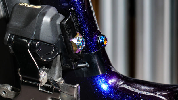 Iridescent bolt on galaxy-patterned bicycle frame