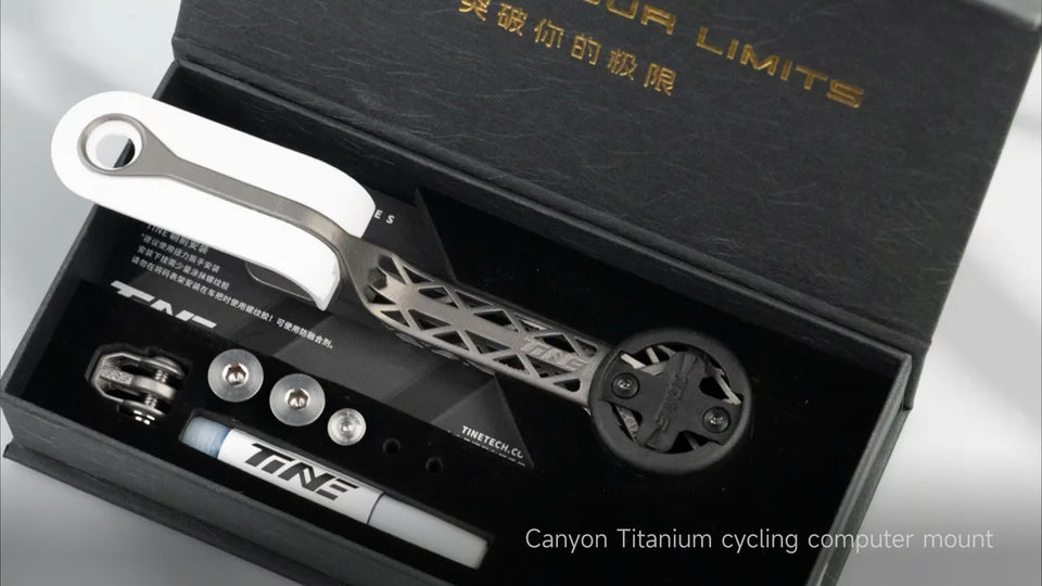 Canyon CP0018 titanium computer mount with geometric cutout design, white rubber grip, circular phone clamp, and mounting hardware displayed in black TiNE TECH packaging