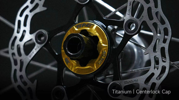 TiNE titanium centerlock cap installed on bicycle hub