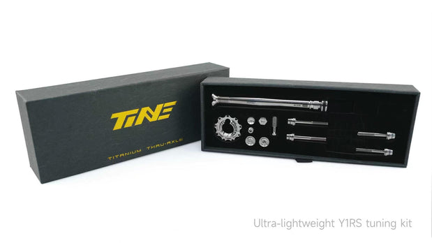 TiNE TECH Colnago Y1RS Titanium Expander Bolt Kit display in black box with yellow logo, showing ultra-lightweight titanium shaft, ring, and hardware components for weight savings.