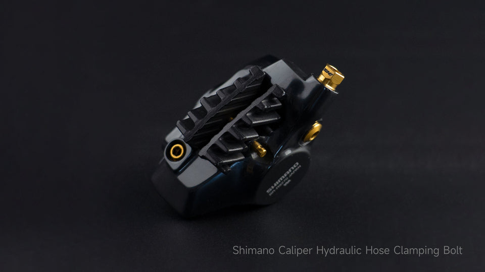 Shimano caliper hydraulic hose clamping bolt with gold titanium finish