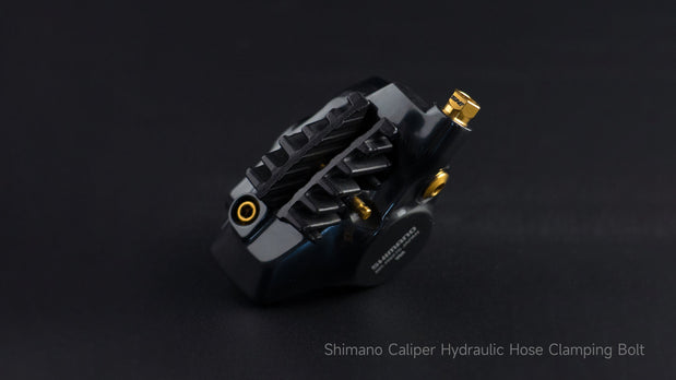 Shimano caliper hydraulic hose clamping bolt with gold titanium finish