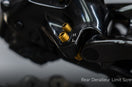Gold titanium Shimano rear derailleur limit screws installed on black 105 R7170 derailleur, showing L H markings, 1.0 g each vs 3.0 g stock.