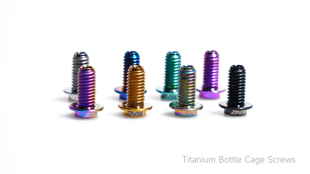 TiNE titanium bottle cage bolts in eight anodized colors purple gold teal blue black and silver on white background