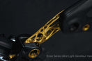 TiNE Tech Eclos ultra-light titanium derailleur hanger with gold lattice design