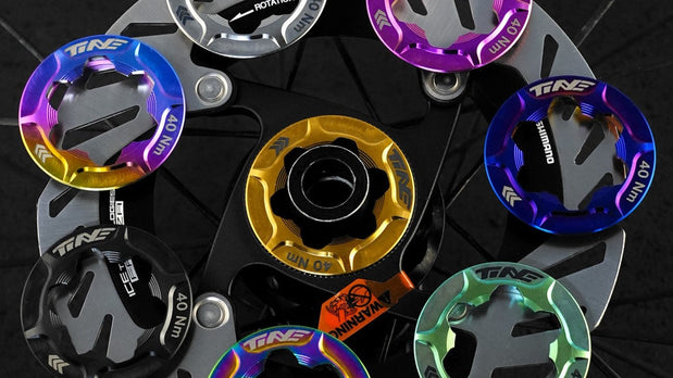 TiNE centerlock vs 6-bolt bike rotor adapters in multiple colors