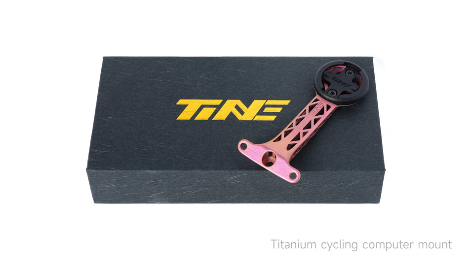 TiNE pink anodized titanium computer mount on TINE box