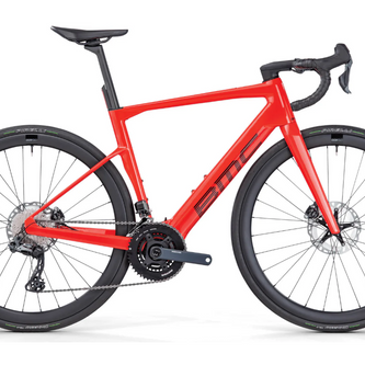 Red ultralight titanium BMC road bike with disc brakes