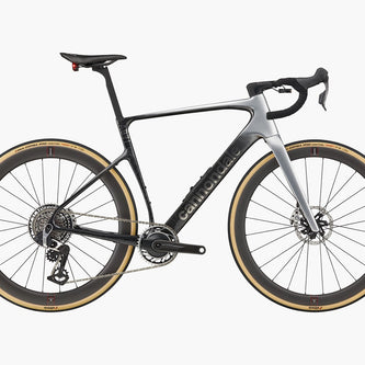 Cannondale road bike with silver titanium frame, premium aftermarket components