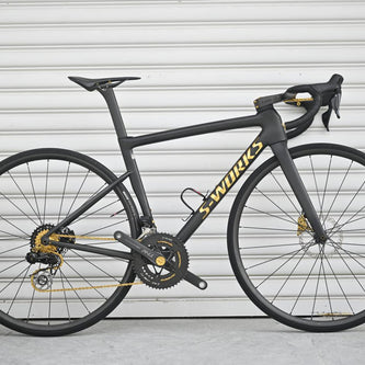 Specialized S-WORKS road bike with gold accents - ultra-lightweight titanium parts