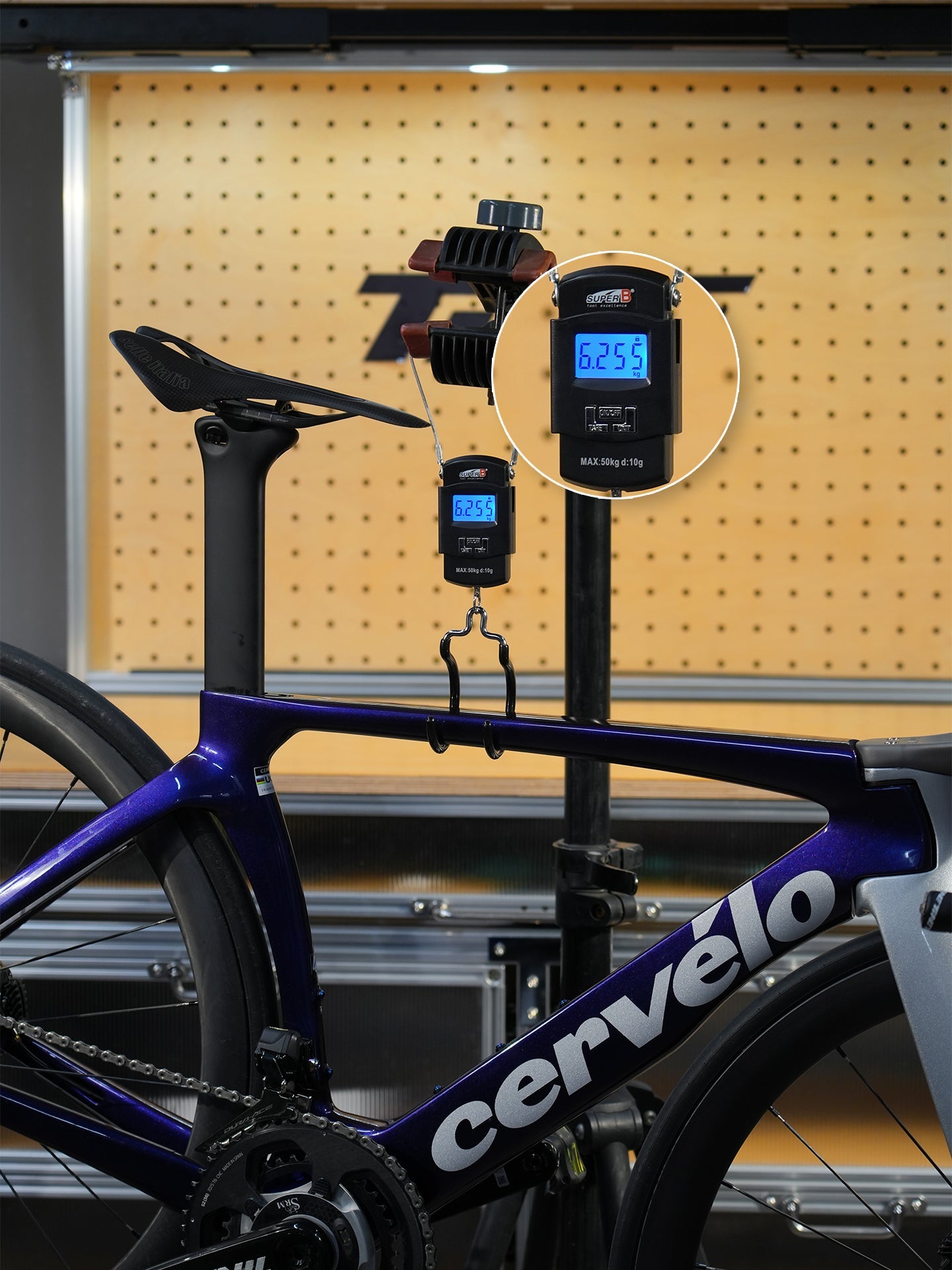 Cervelo bicycle with digital scale measuring weight - SHIMANO titanium alloy parts