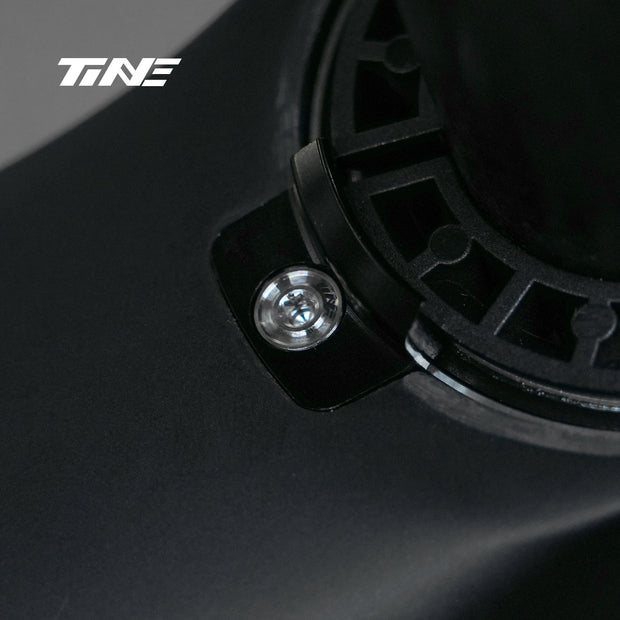 TiNE SL9 titanium screw installed in black bicycle frame section