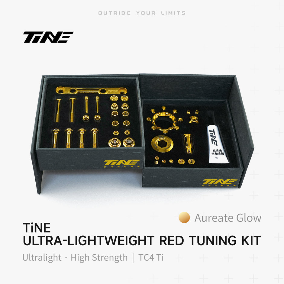TiNE Tech titanium road bike bolt kit in box with Aureate Glow hardware