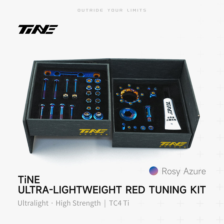 TiNE Tech titanium road bike bolt kit in box with Rosy Azure hardware