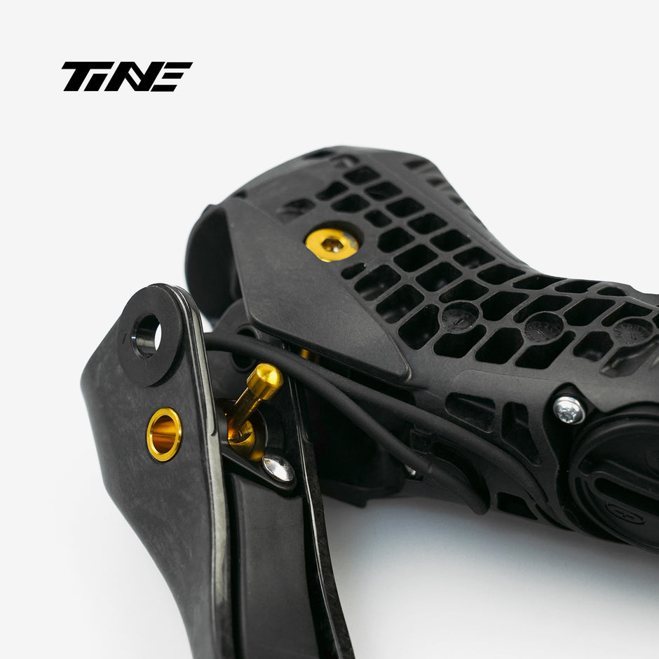 TiNE Titanium Shifter Bolt Kit for SRAM RED - close-up of black shifter with gold bolt