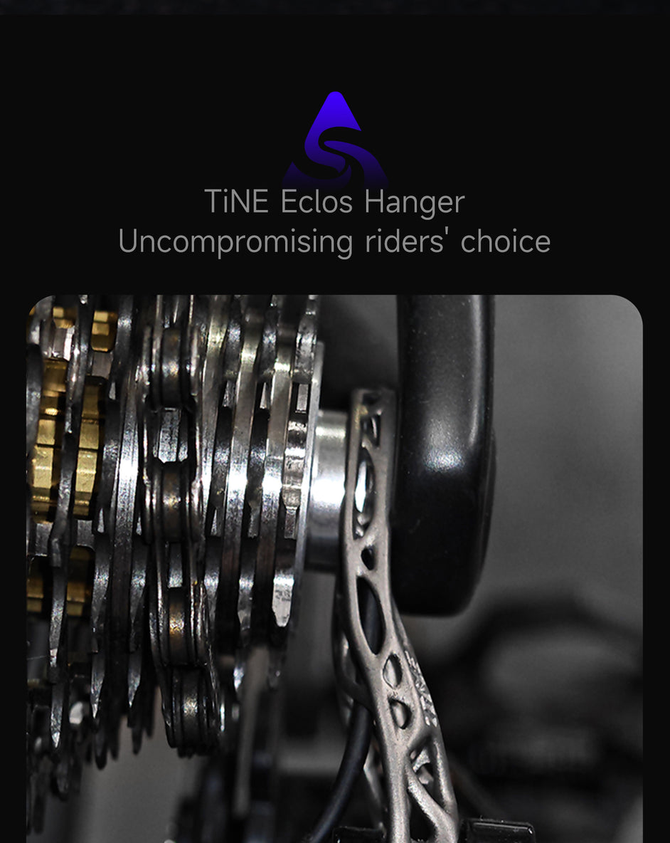 Close-up of titanium derailleur hanger with metallic gears for road bike upgrades at TiNE TECH