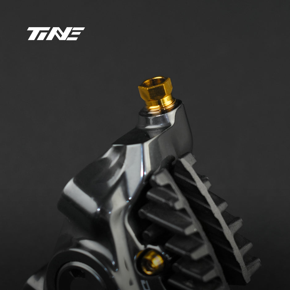 TiNE gold titanium screw installed in Shimano caliper component