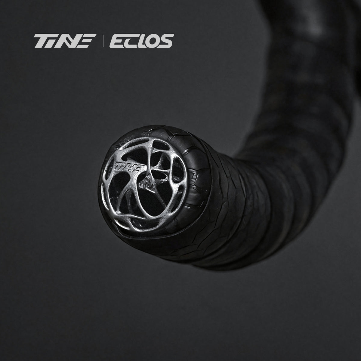 TiNE ECLOS 3g TC4 titanium bar end plug on handlebar with black tape